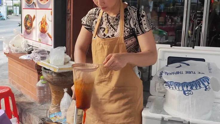 Ploy Sai preparing coffee