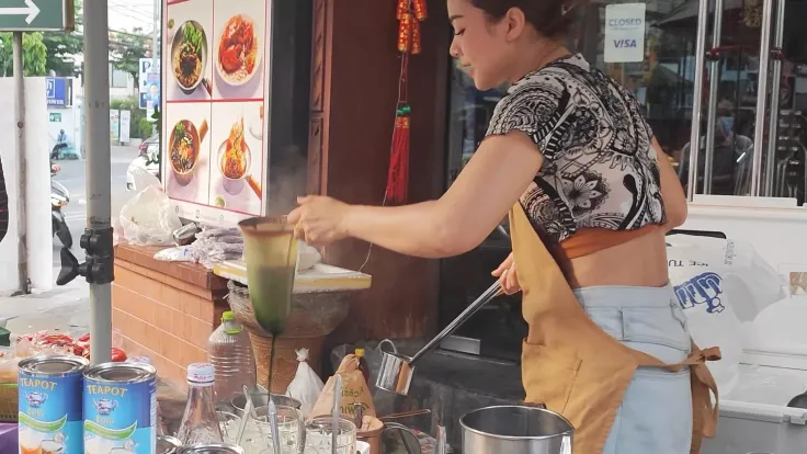 Ploy Sai Coffee Lady serving customers