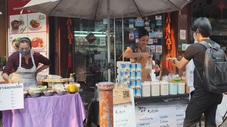 Ploy Sai Coffee Lady serving customers