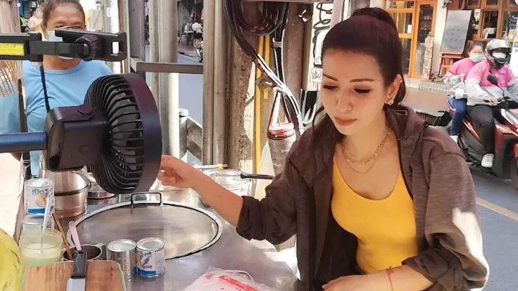 Once the stove is ready, the roti lady meticulously prepares her ingredients